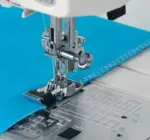 foot c controls fabric for accurate overedge stitching and finishing
