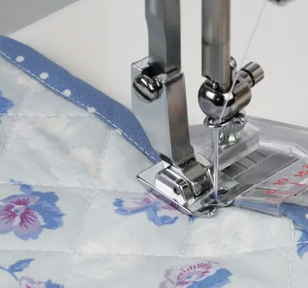 janome taping foot makes applying binding tape fast and accurate